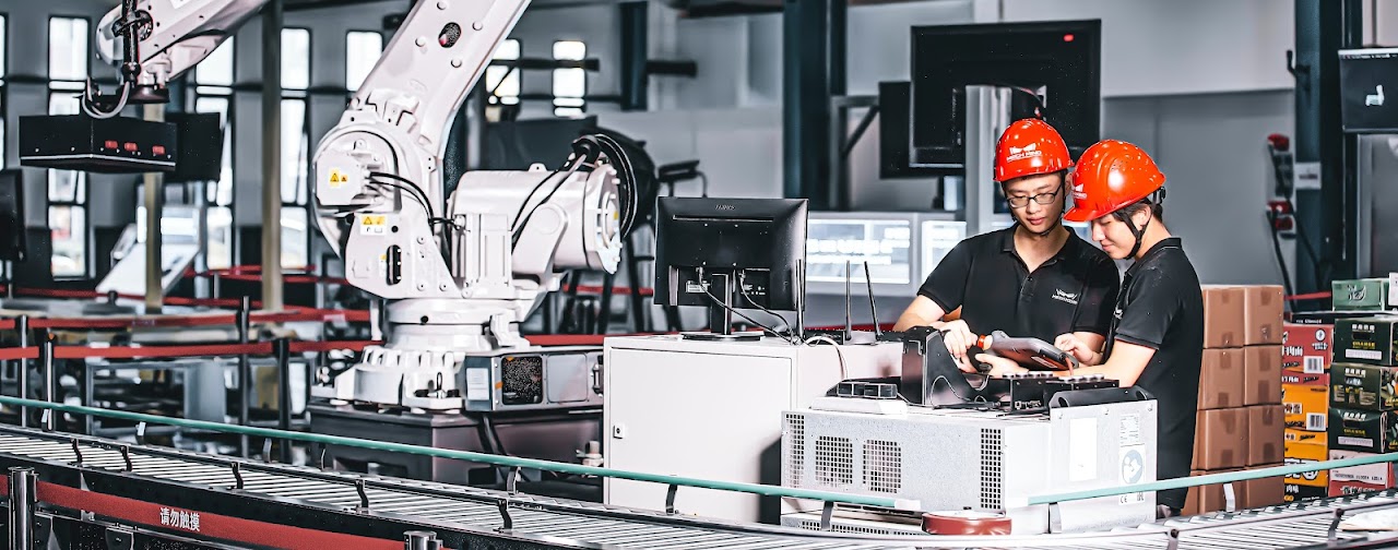 Workers in electronics production facility